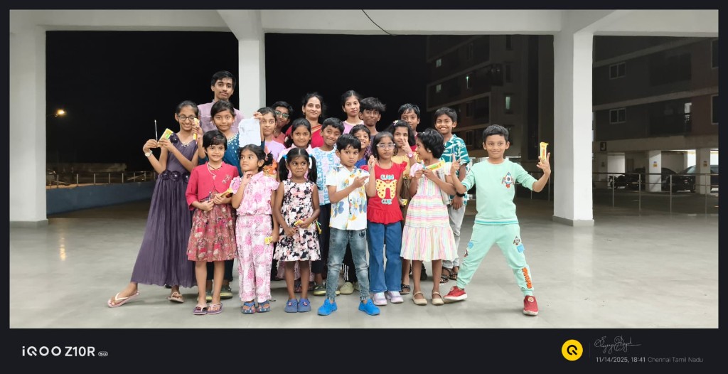 Children celebrating Children's Day together outdoors at night