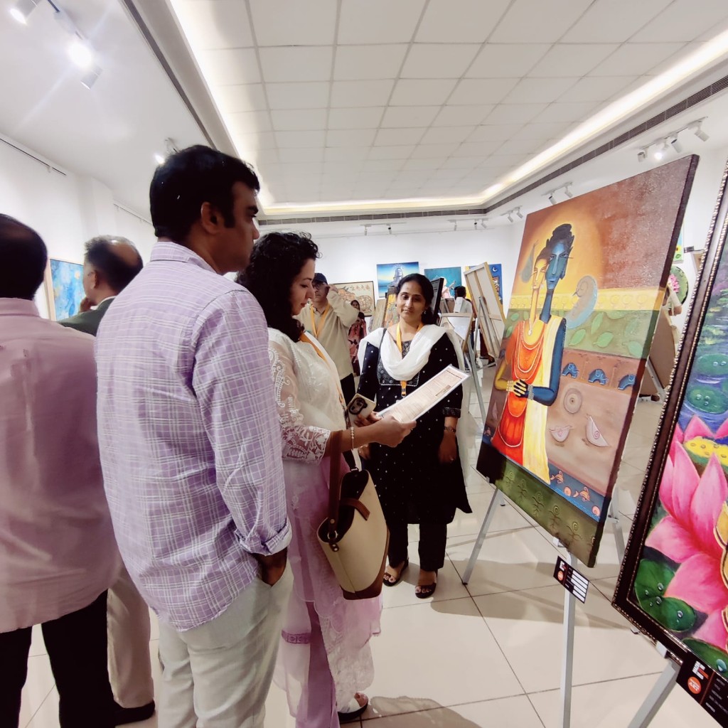 Visitors viewing an artwork at an art gallery opening
